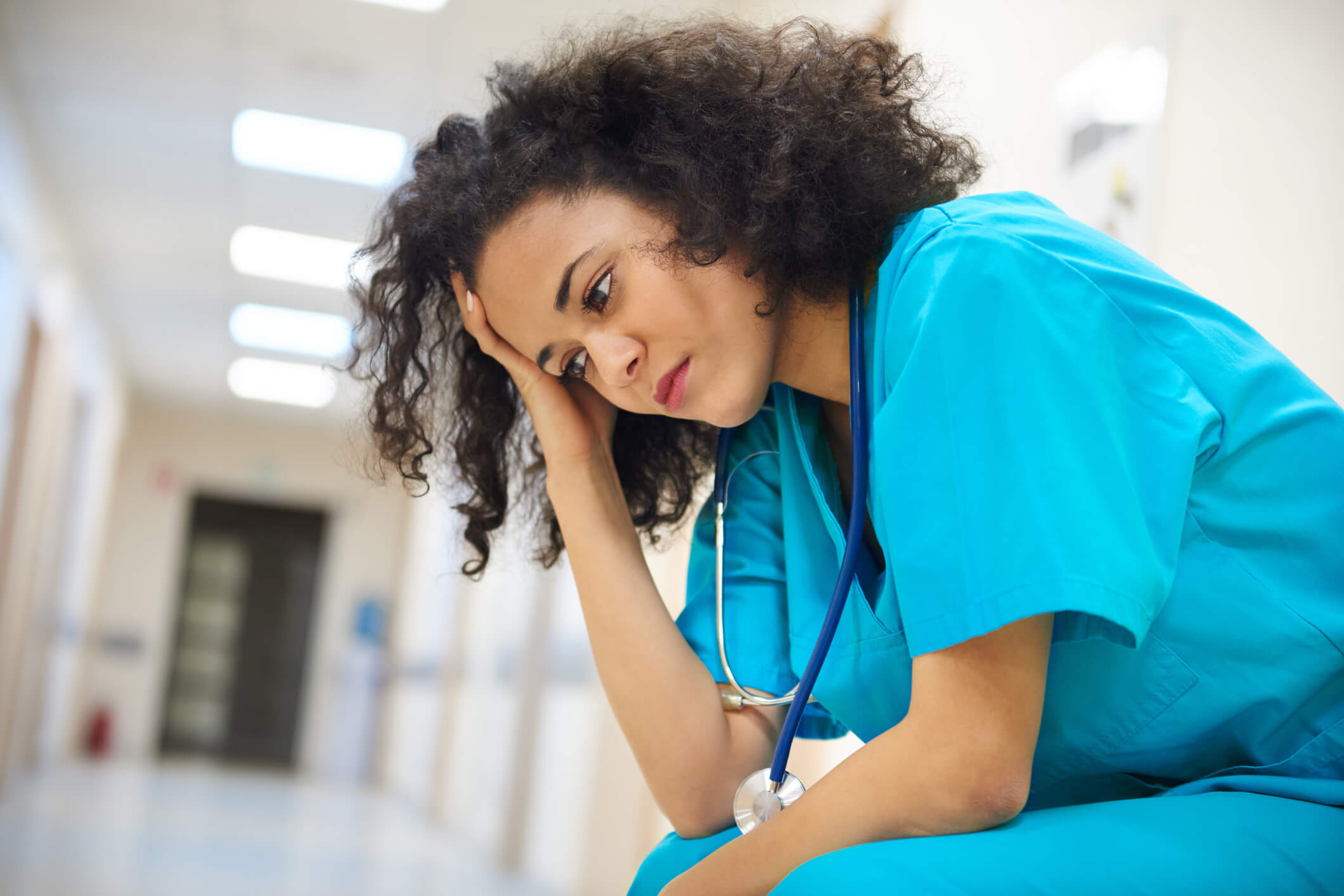 Female nurse looking stressed