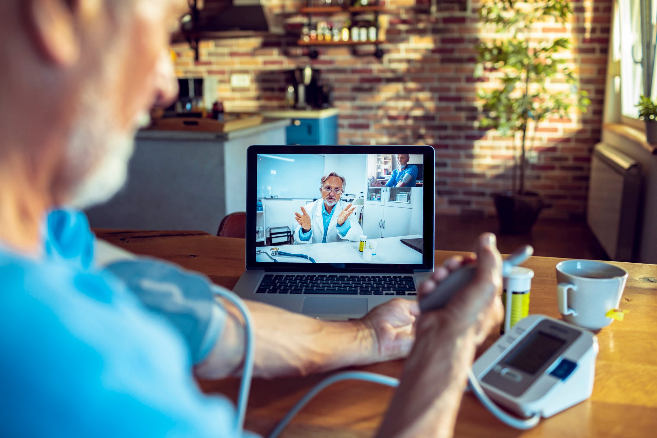 Senior patient consulting with doctor online during telehealth visit