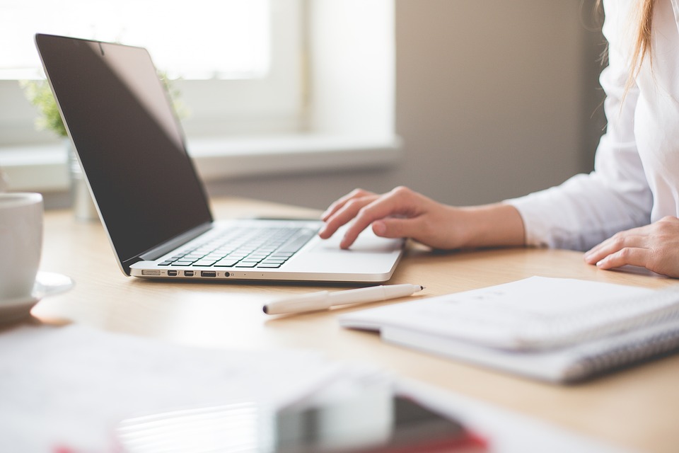 Woman typing on computer