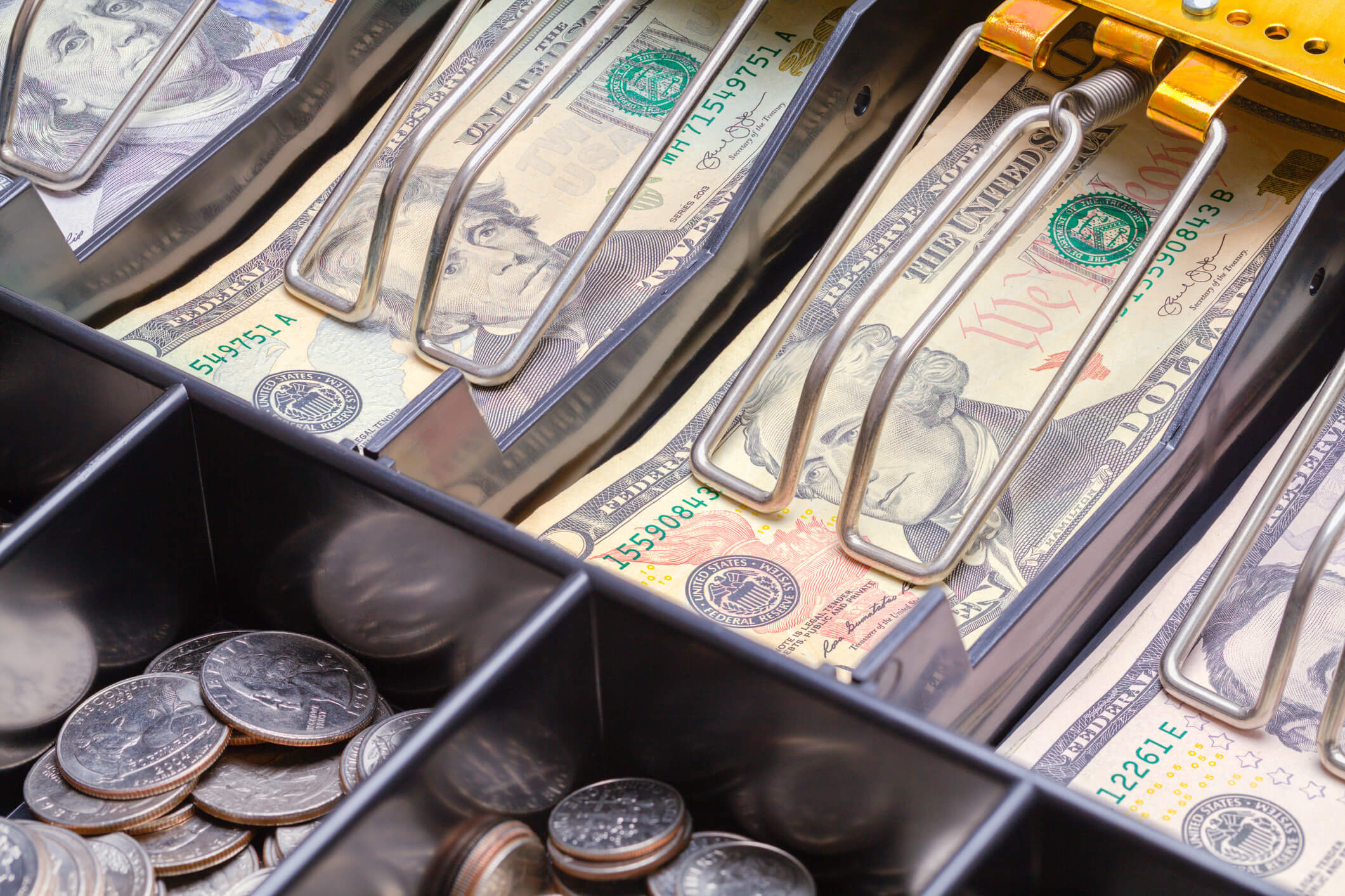 Cash register full of money
