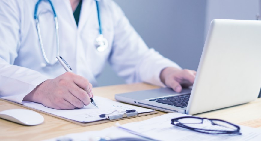 remote patient monitoring by doctor at laptop