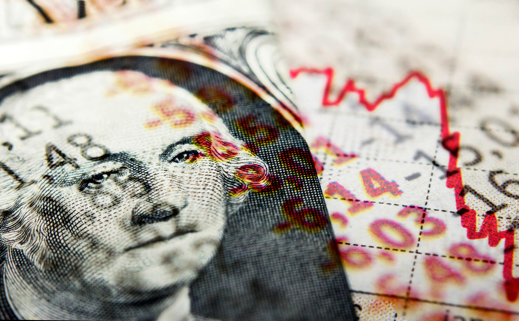 Red stock market line indicating recession and superimposed dollar bill