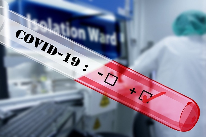 A vial with a check mark indicating COVID-19 positivity