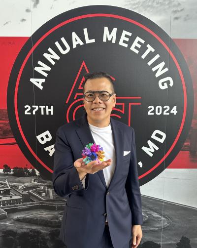 An image of Ring Therapeutics CEO Tuyen Ong holding a 3D model of the company's Anellovectors at the ASGCT's 2024 annual meeting. He has described the vector as working a bit like the Death Star from Star Wars, with modular layers that click into place.